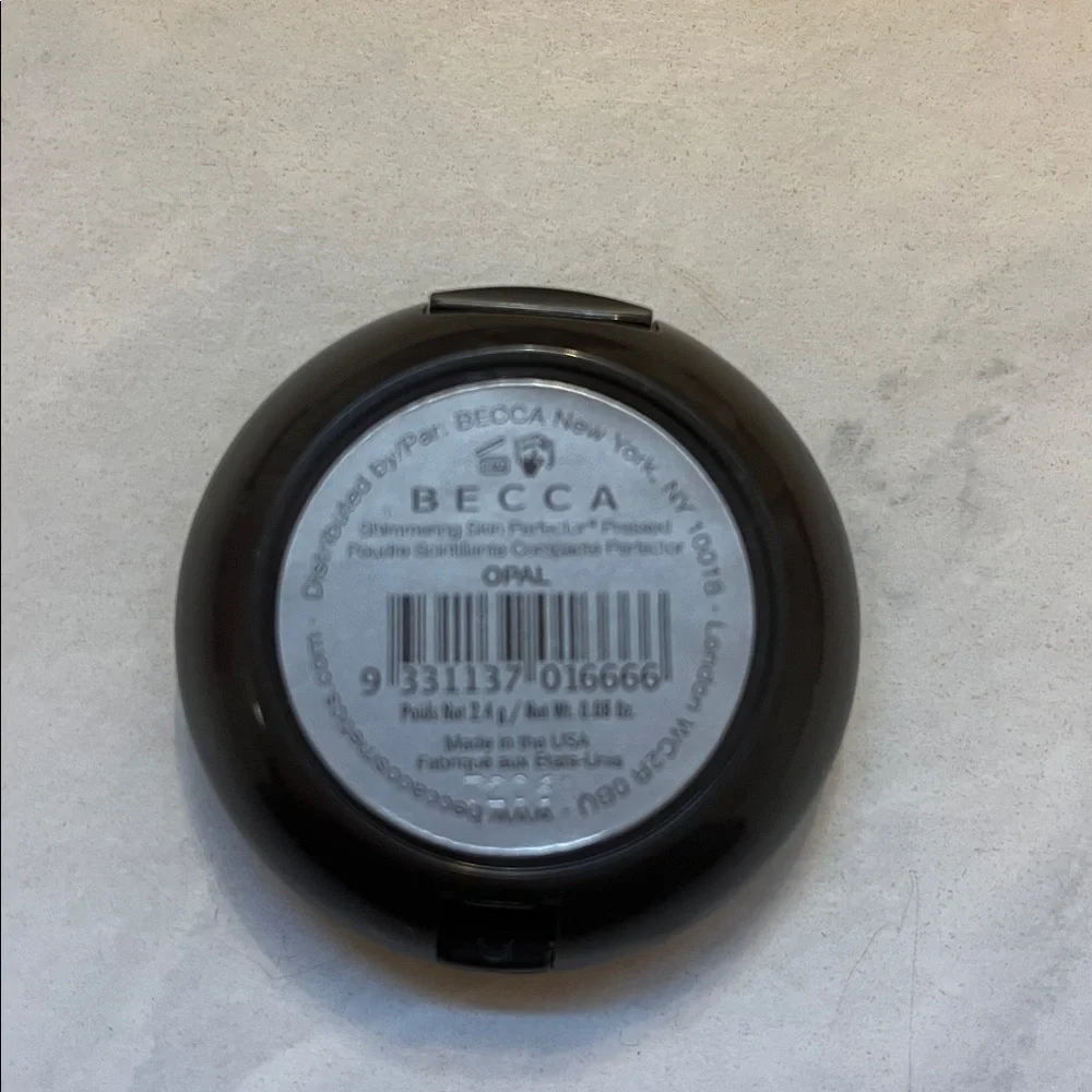 BECCA shimmering skin perfector pressed powder compact opal